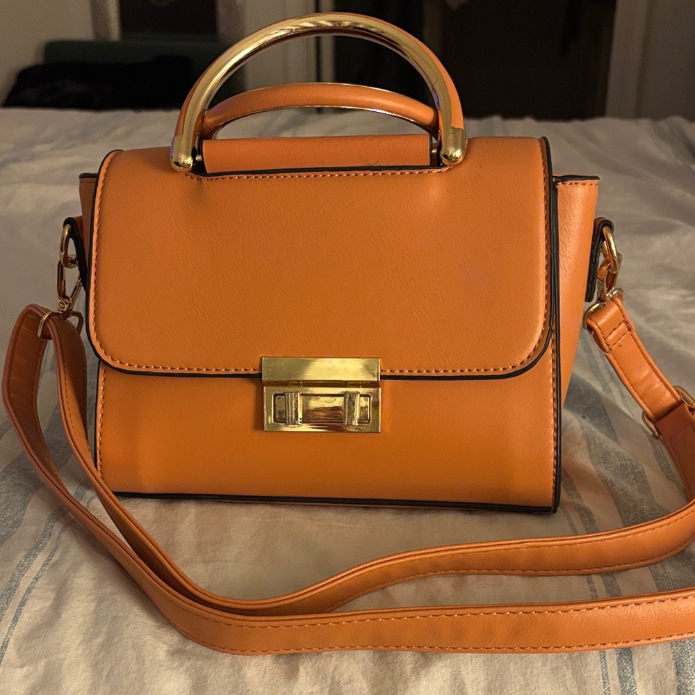 Elegant Orange Handbag with Gold Accents